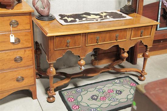 Appraisal: WILLIAM AND MARY STYLE DESK Mahogany veneered desk having three