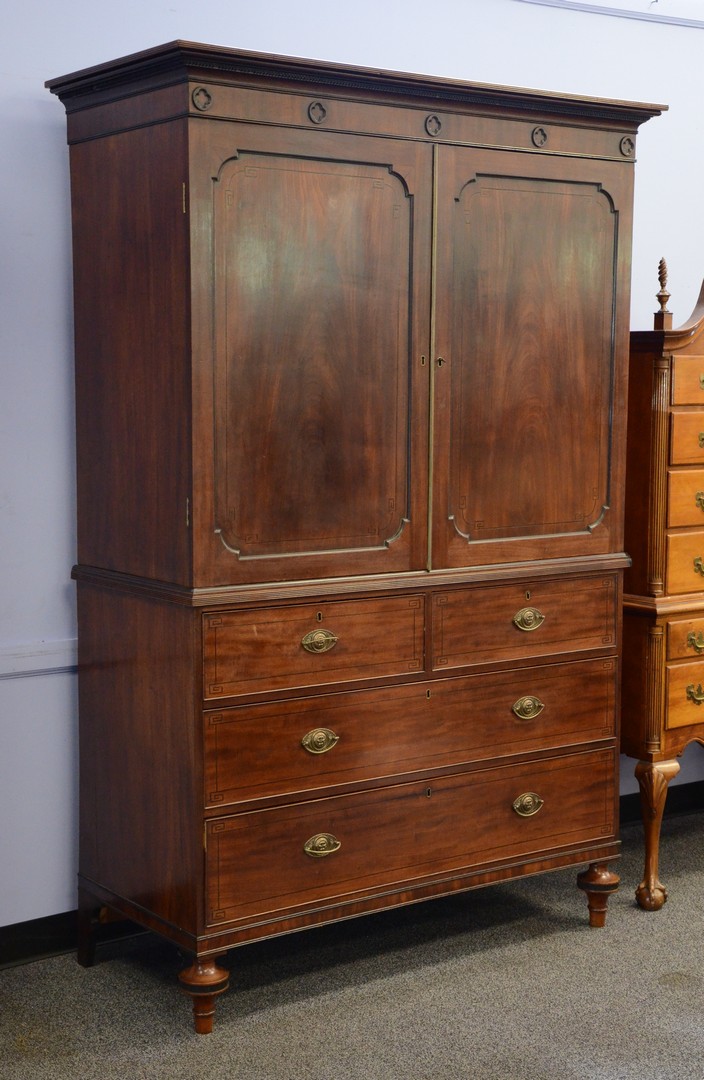 Appraisal: Regency mahogany linen press removable cornice section over a door