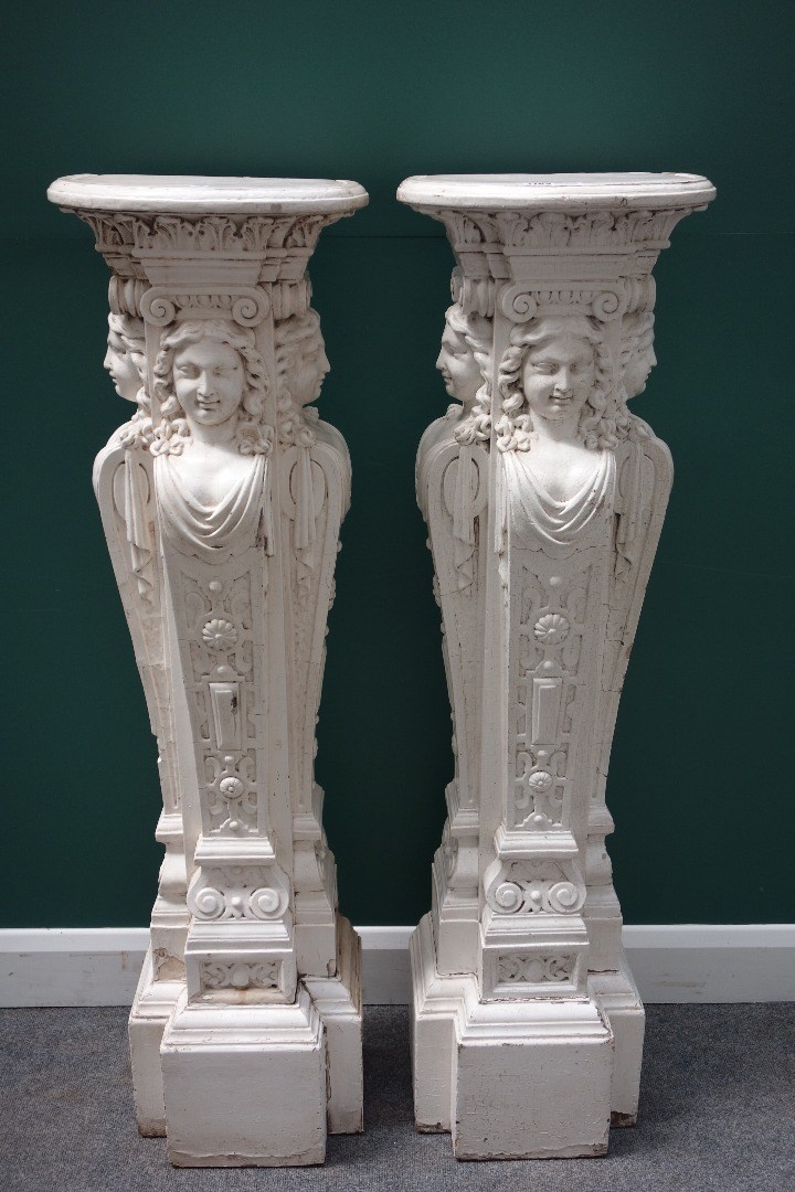 Appraisal: A pair of white painted carved wood pedestals each formed