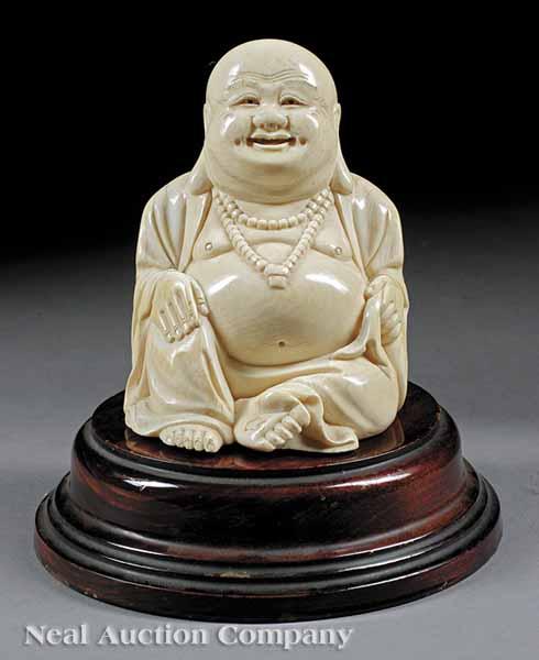 Appraisal: A Chinese Carved Ivory Figure of Budai the laughing figure