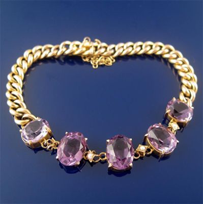 Appraisal: A gold bracelet mounted with five graduated oval shaped amethysts