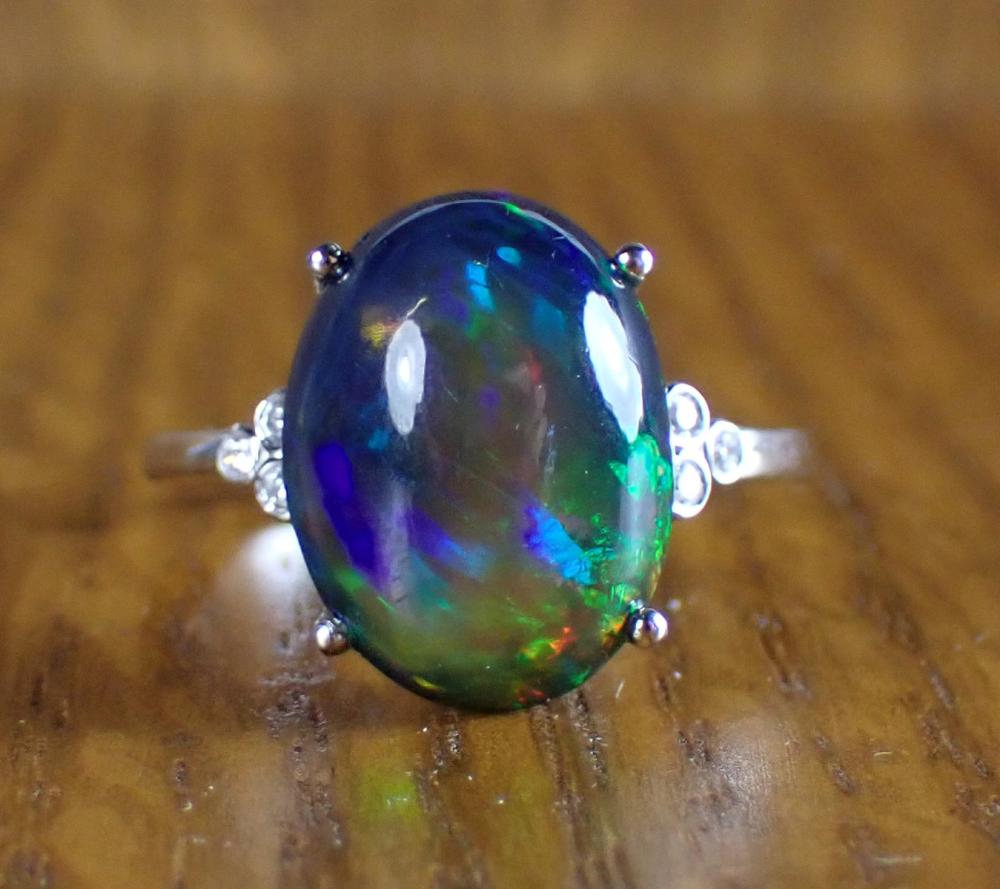 Appraisal: BLACK OPAL DIAMOND AND FOURTEEN KARAT GOLD RING The k