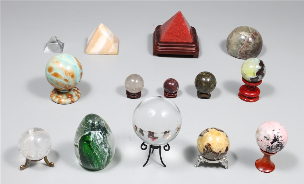 Appraisal: Group of seventeen crystal and mineral orbs with stands mineral