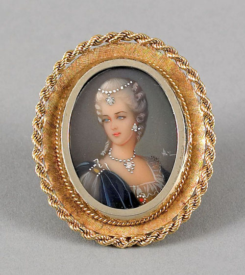 Appraisal: K yellow gold framed painted female portrait brooch the portrait