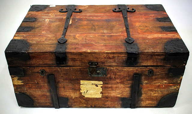 Appraisal: AN ANTIQUE PINE AND METAL BOUND TRAVELLING CHEST with a