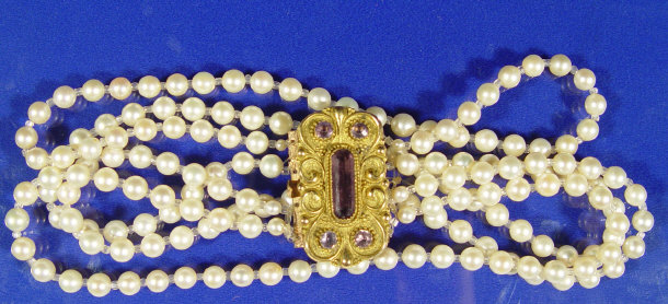 Appraisal: Pearl necklace on a gilt metal purple stone clasp