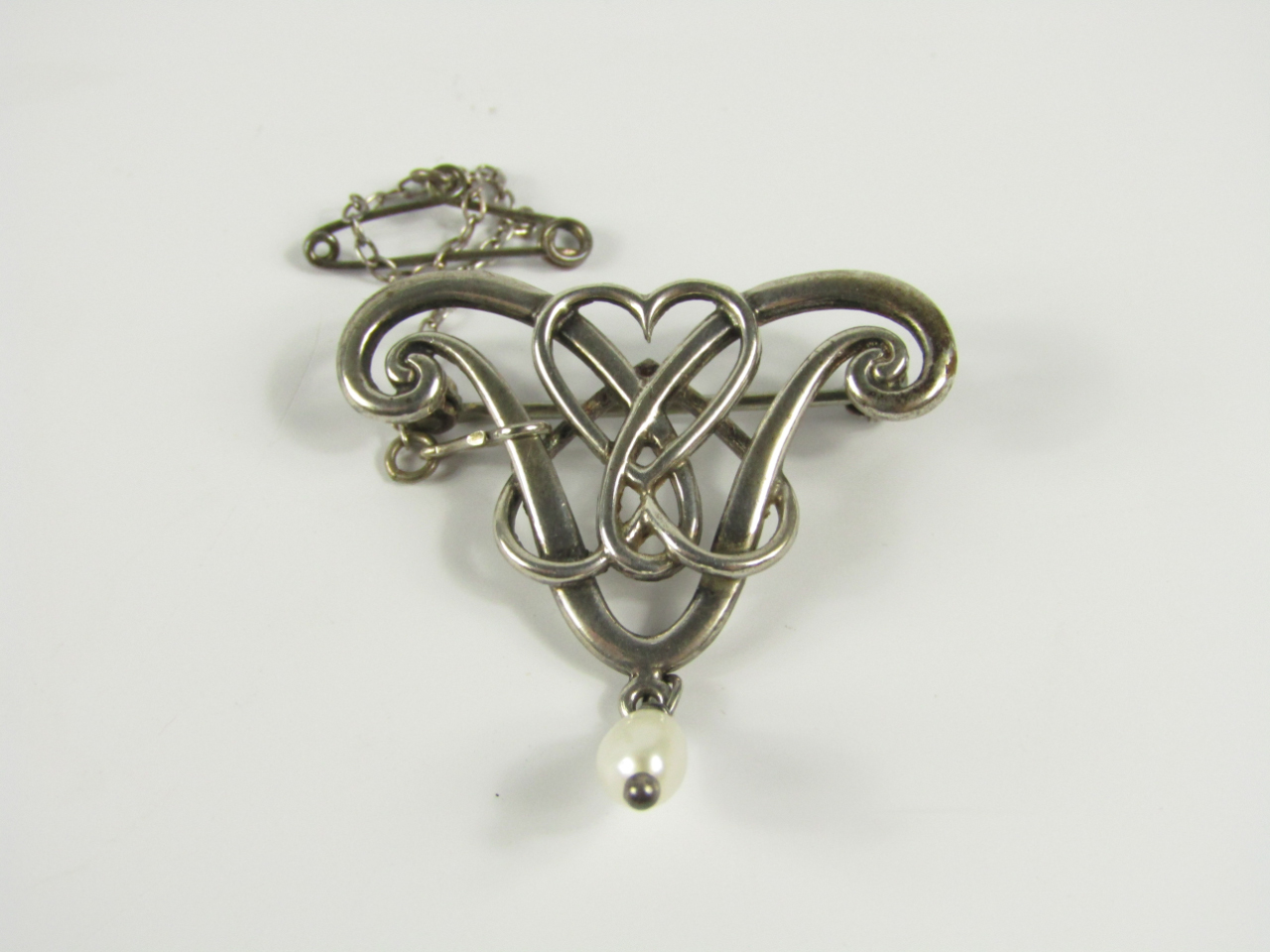 Appraisal: A modern Sterling silver brooch of Art Nouveau design set