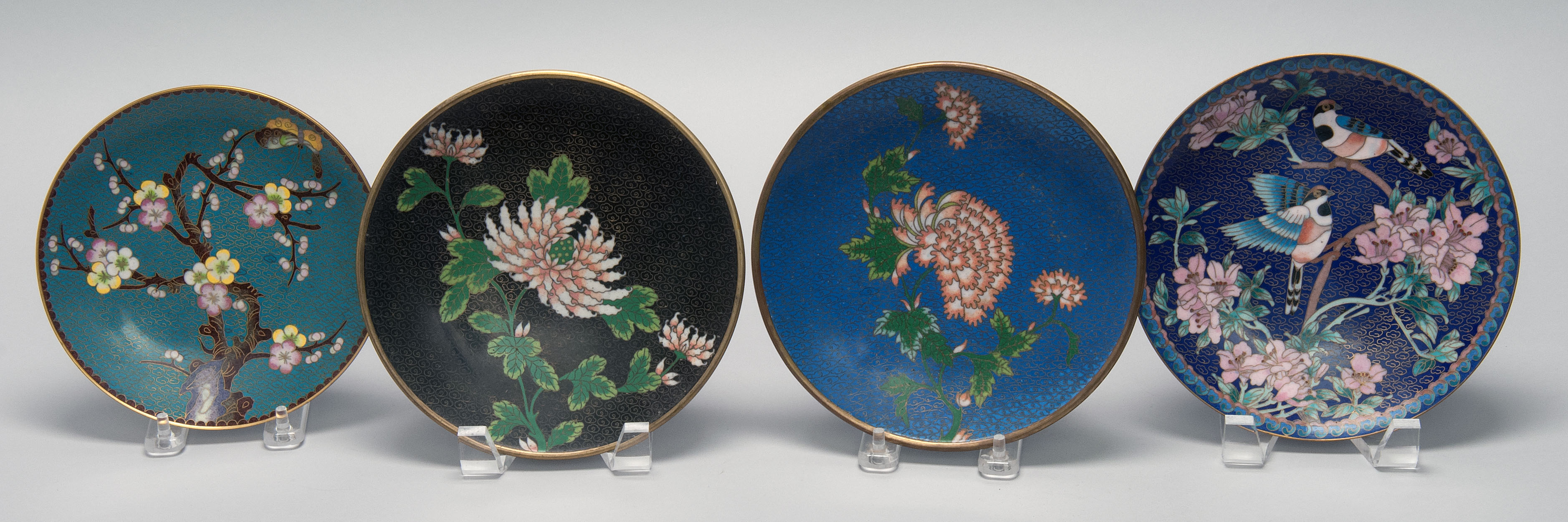 Appraisal: FOUR CLOISONN ENAMEL PLATES th CenturyAll with floral decoration Diameters