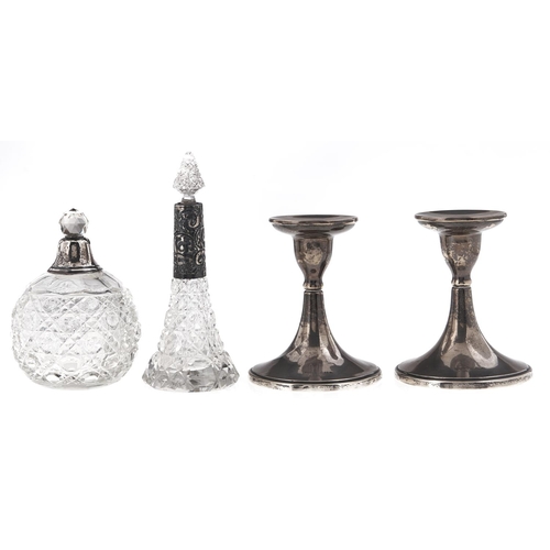 Appraisal: A pair of George V dwarf silver candlesticks cm h