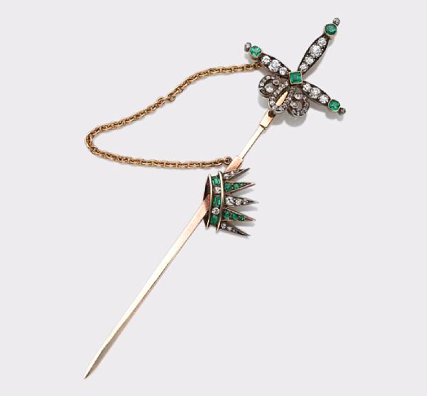 Appraisal: A diamond and emerald jabot the scabbard accented by a