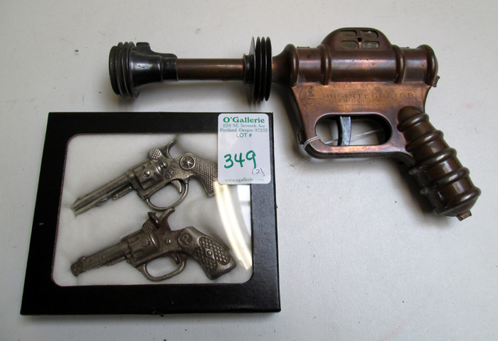 Appraisal: THREE COLLECTIBLE TOY GUNS Daisy Buck Rogers Disintegrator copper plated