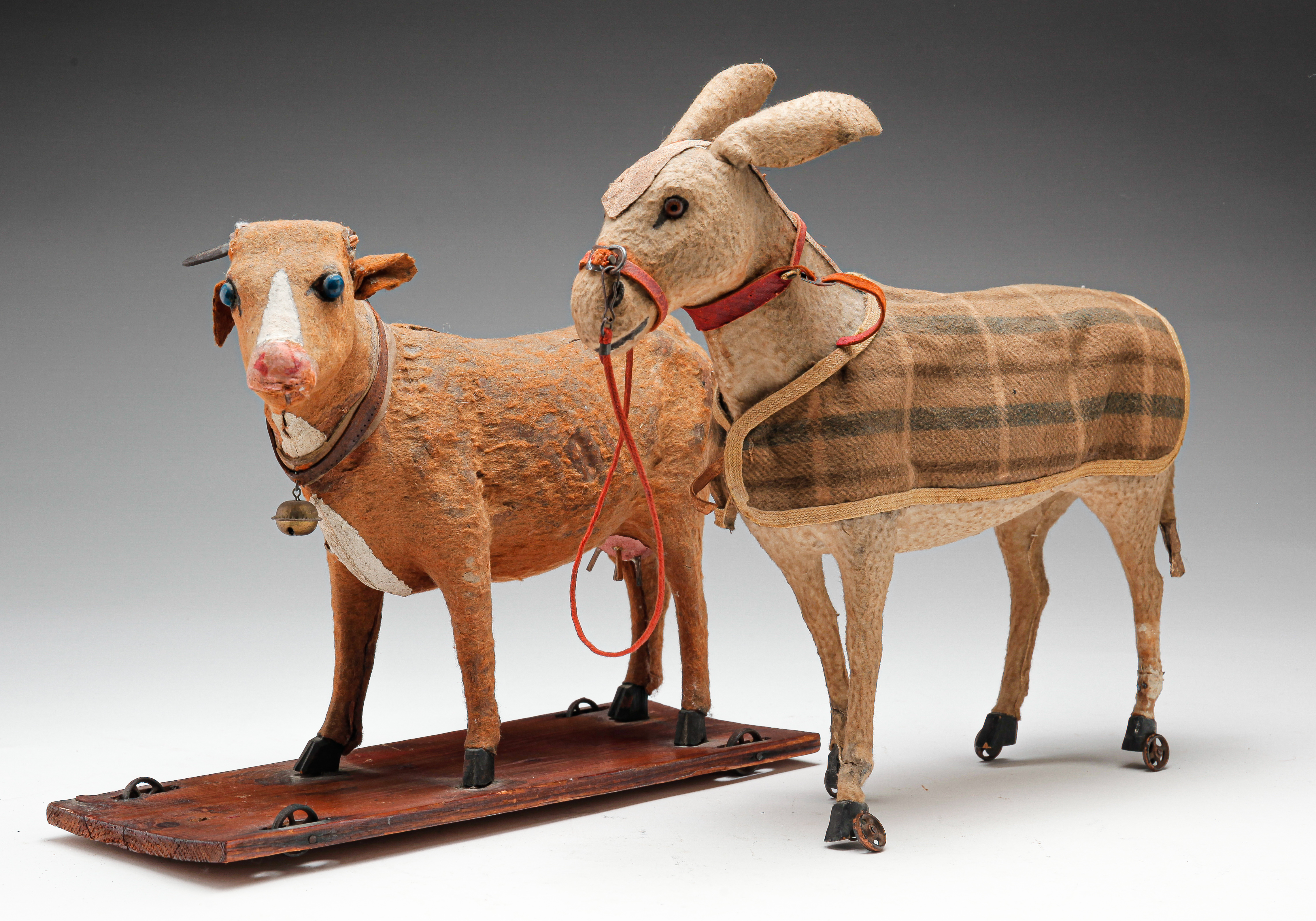 Appraisal: TWO GERMAN PULL TOYS Ca Papier mache with felt coats