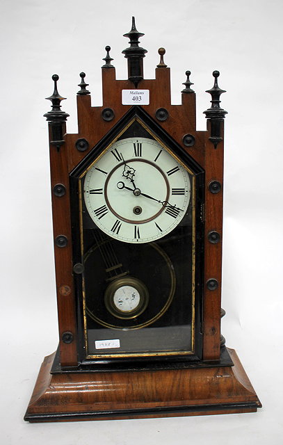 Appraisal: A TH CENTURY WALNUT MANTLE CLOCK with castellated top and