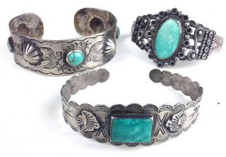 Appraisal: Three Southwest silver hardstone bangle bracelets one with peace symbols