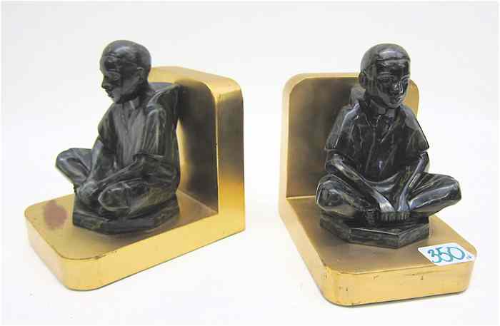 Appraisal: PAIR RONSON METAL BOOKENDS with a young man seated cross