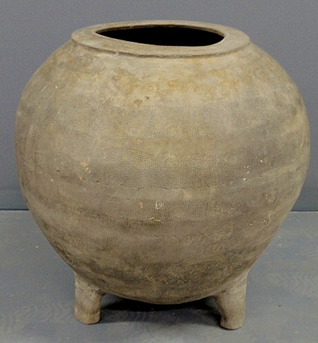 Appraisal: Large grey pottery vessel with peg feet h opening dia