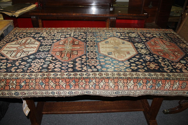 Appraisal: A HAMADAN BLUE GROUND RUG with running borders and quadruple