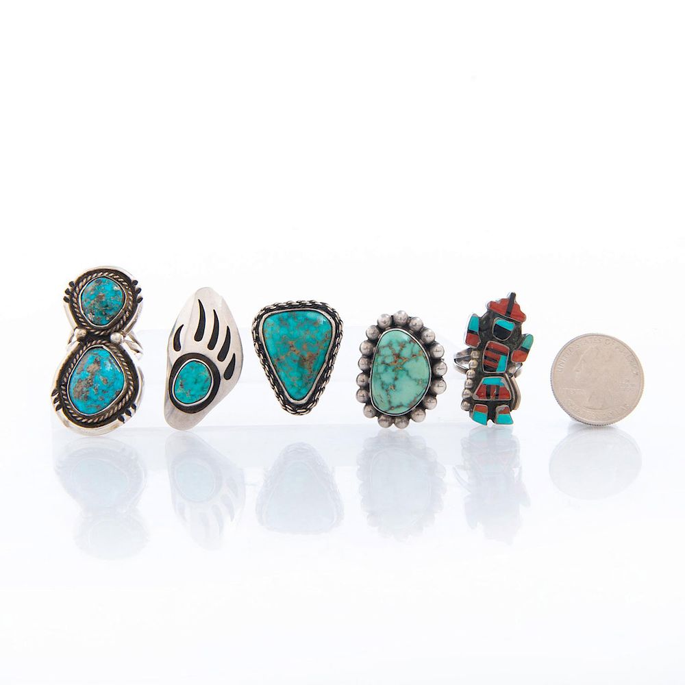 Appraisal: NATIVE AMERICAN TRIBAL SILVER AND TURQUOISE RINGS Turquoise with inclusions