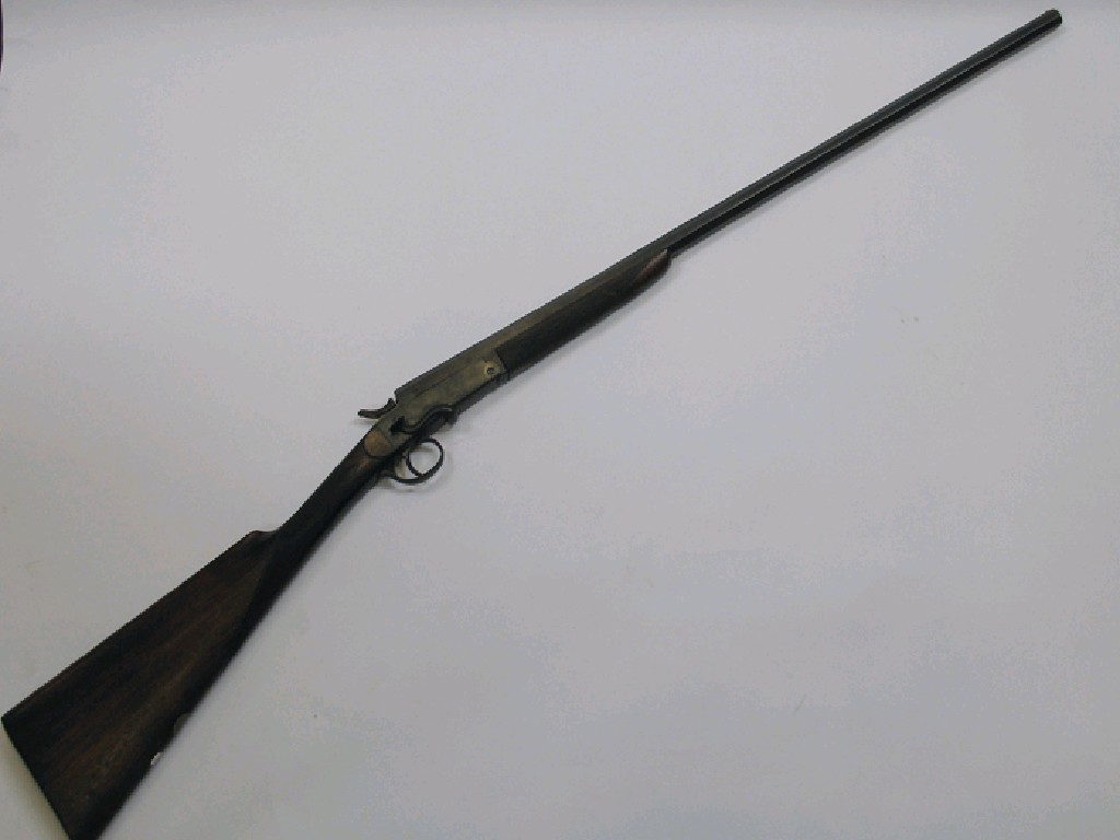 Appraisal: A SINGLE BARREL GAUGE SHOTGUN the octagonal barrel stamped with