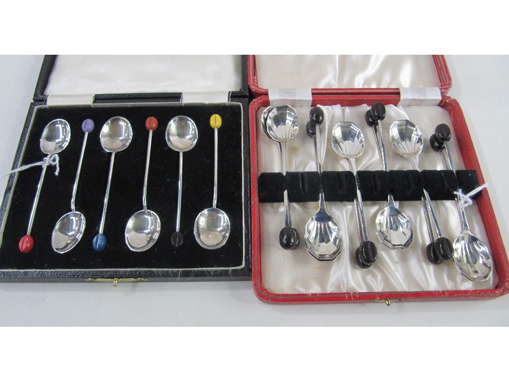 Appraisal: Lot comprising two cased sets of silver coffee bean spoons