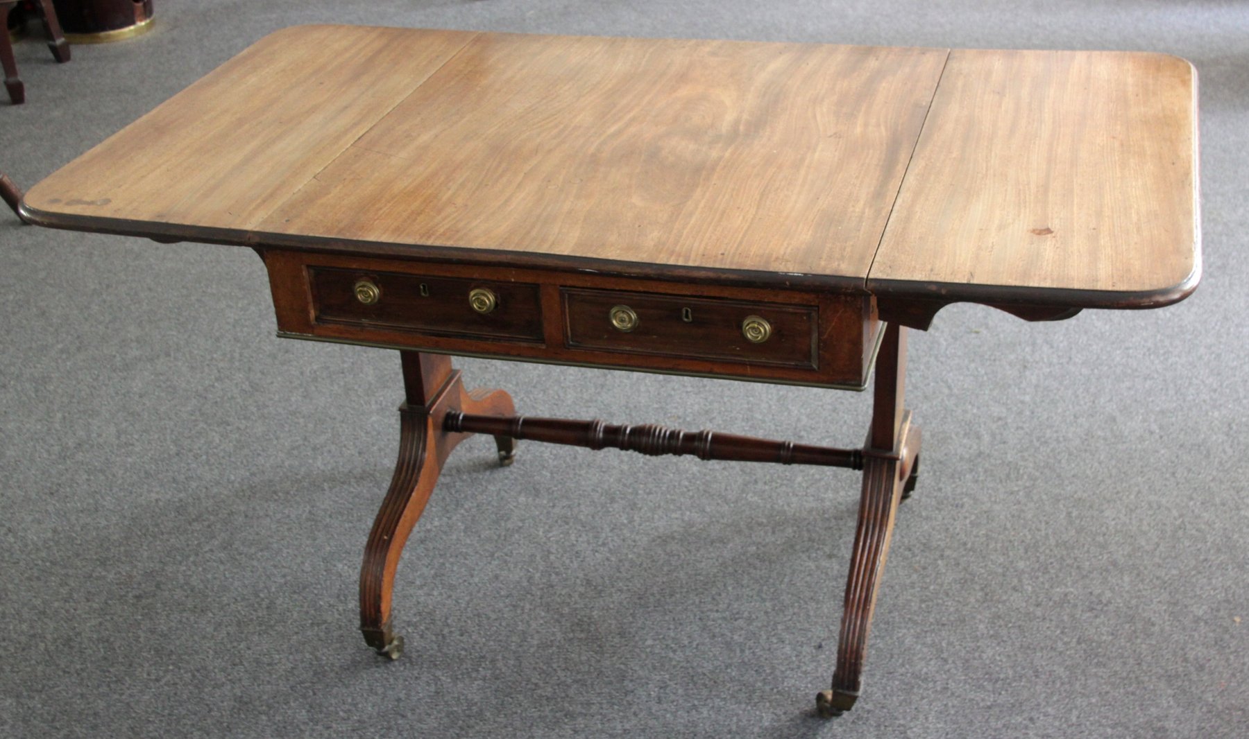 Appraisal: A mahogany sofa table of George III style circa the