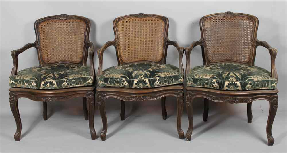 Appraisal: SET OF THREE REGENCE STYLE MAHOGANY CANED ARMCHAIRS each cartouche-form