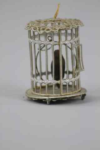 Appraisal: BIRD IN GILDED CAGE DRESDEN ORNAMENT Germany bird on perch