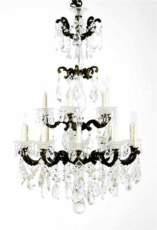 Appraisal: Continental bronze and crystal fourteen-light chandelier early th century four-tier