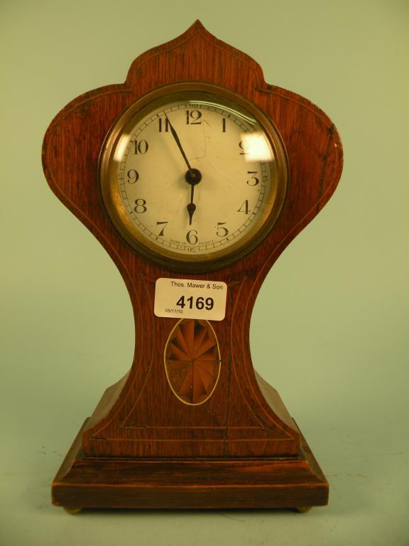 Appraisal: An Edwardian oak mantel clock the case inlaid with a