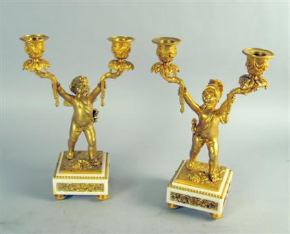 Appraisal: Pair of Louis XV style gilt bronze figural candelabra Each