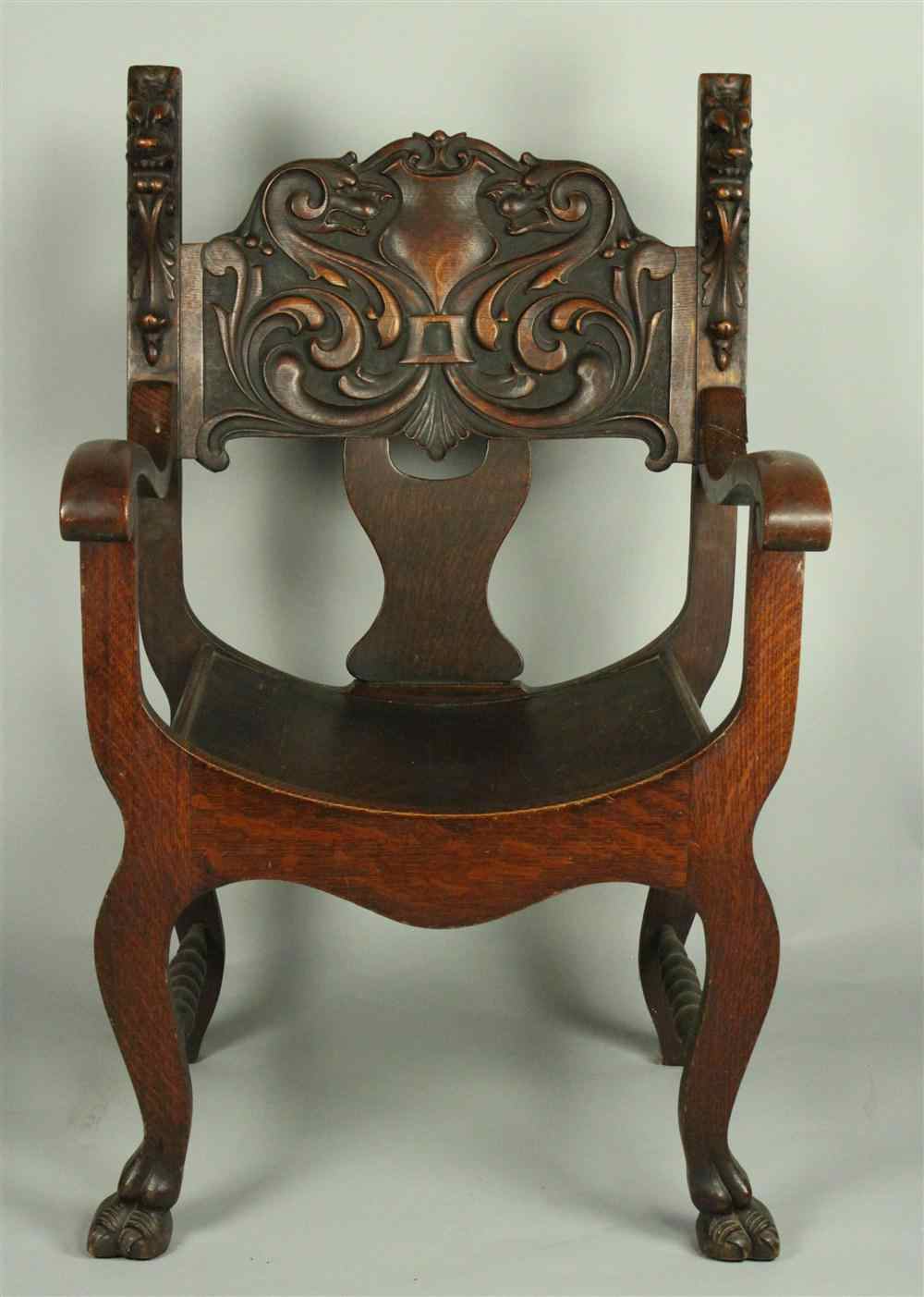 Appraisal: RENAISSANCE CARVED OAK THRONE CHAIR having upward extending side stiled