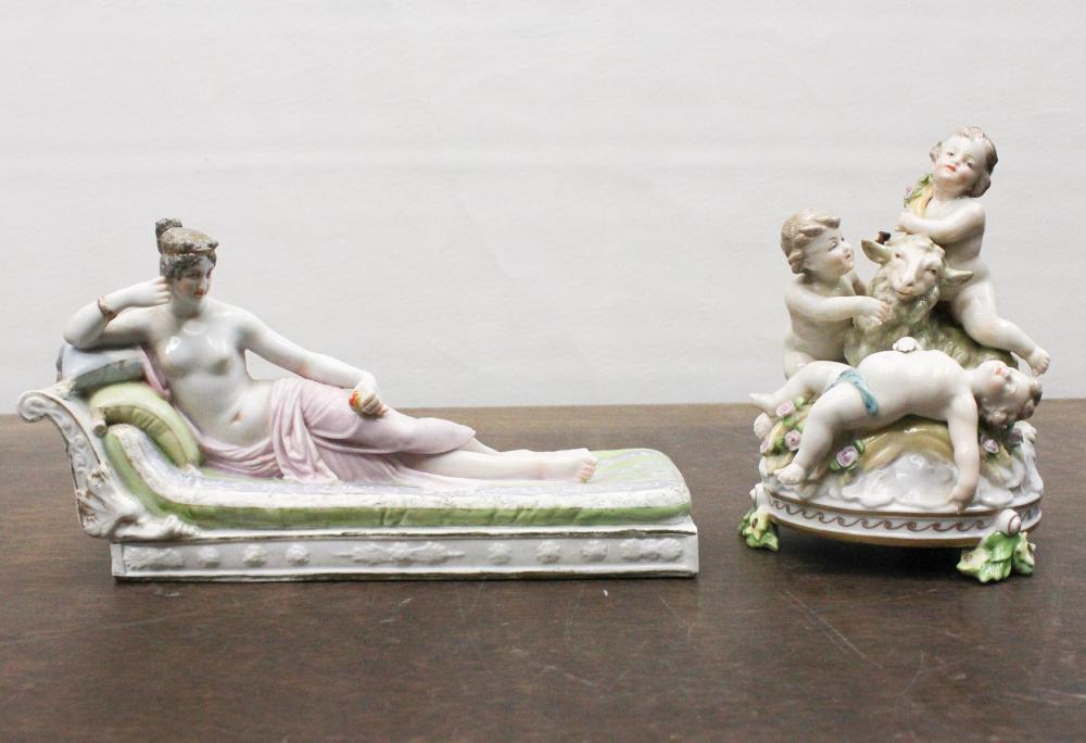 Appraisal: TWO PORCELAIN FIGURAL SCULPTURES figural group featuring putti figures surrounding