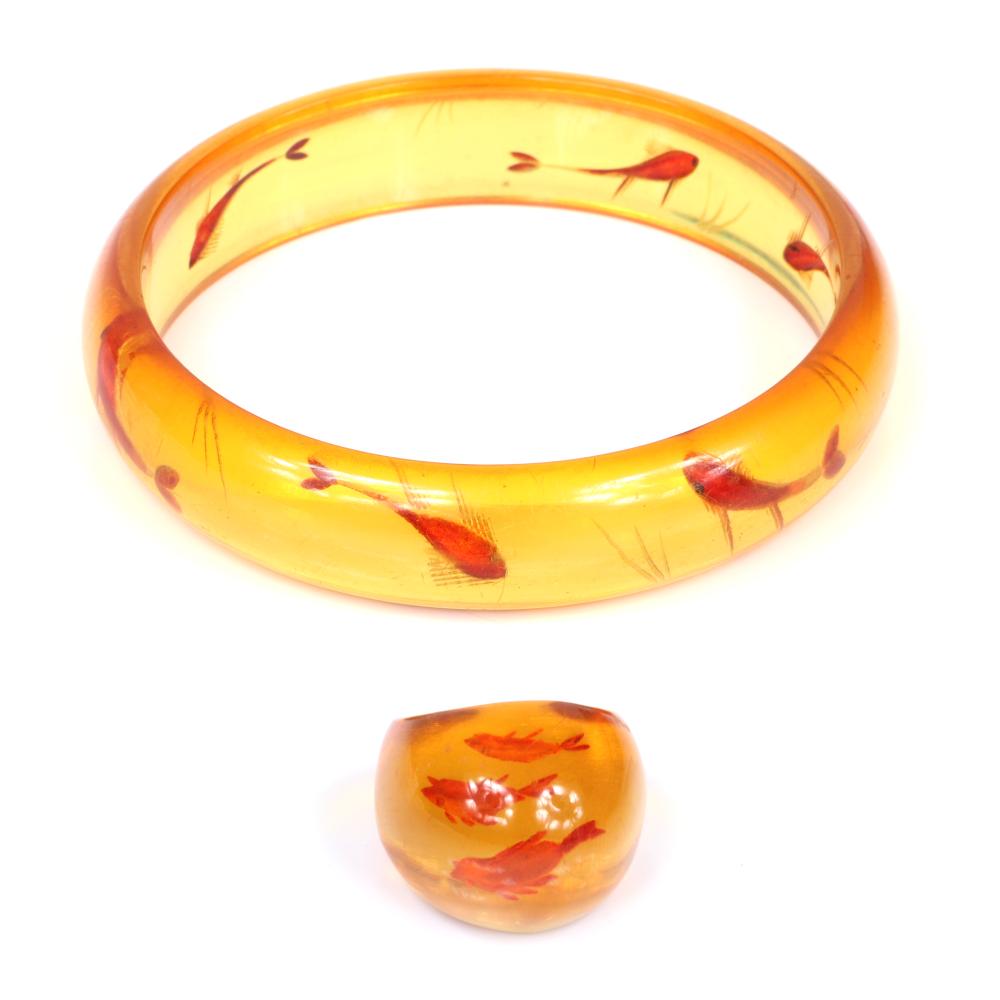 Appraisal: VINTAGE BAKELITE PC REVERSE CARVED AND PAINTED APPLEJUICE FISHBOWL BANGLE