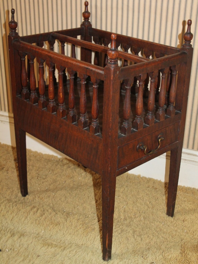 Appraisal: A Victorian oak Canterbury with baluster gallery and single drawer