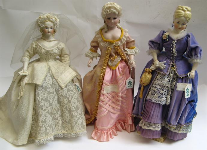 Appraisal: THREE PAINTED BISQUE CHARACTER DOLLS created by Lena Swartz and