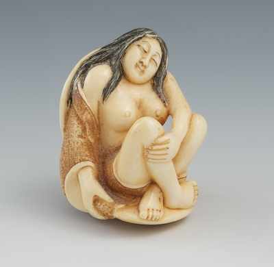 Appraisal: A Carved Ivory Netsuke of a Seated Woman The seated