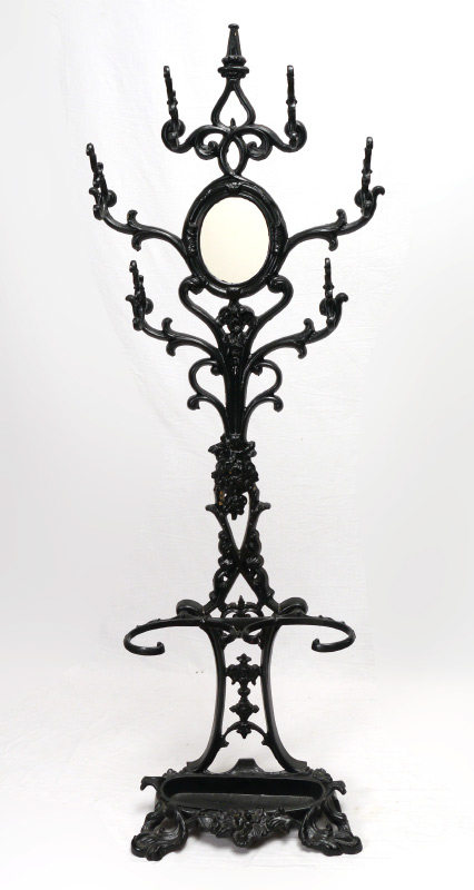 Appraisal: VICTORIAN WROUGHT IRON HALL TREE Black painted with central mirror