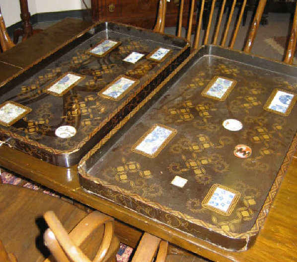 Appraisal: NEST OF TWO ASIAN LACQUERED AND PORCELAIN TRAYS Brown with