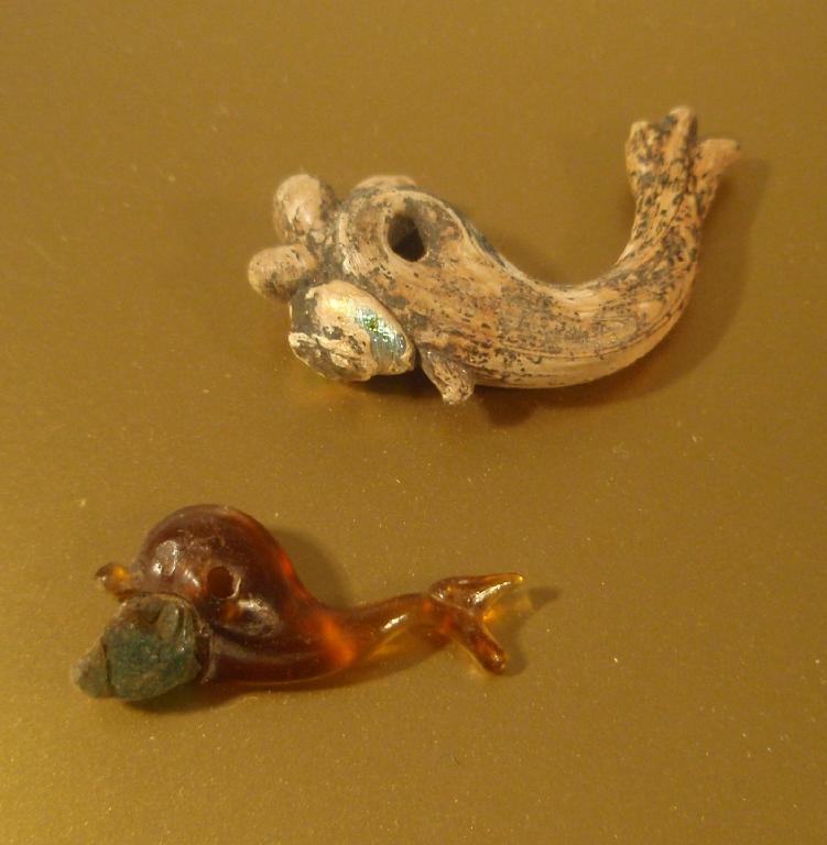 Appraisal: A Roman or early Byzantine blue dolphin-shaped glass pendant with