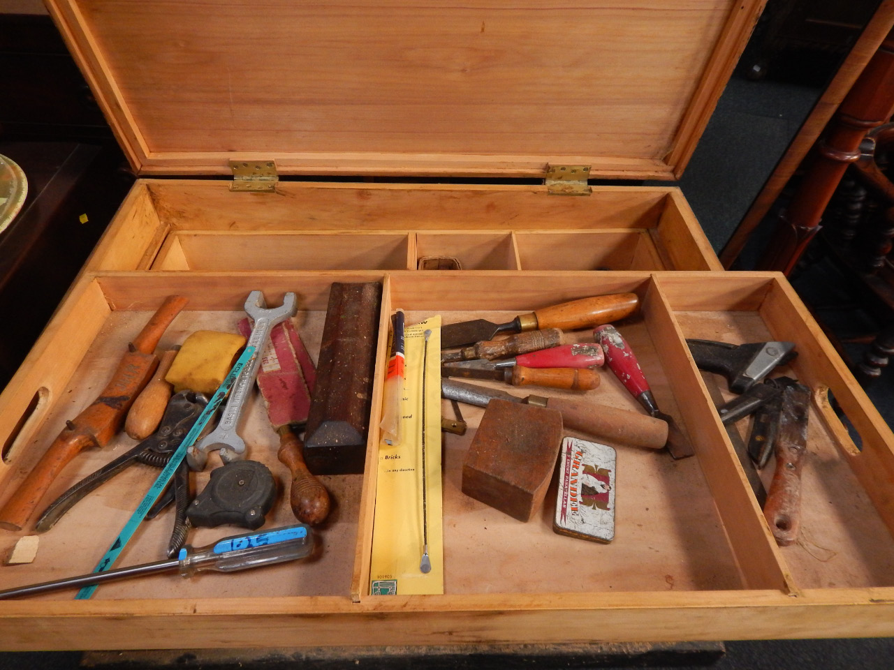 Appraisal: A black painted pine carpenter's tool chest containing a quantity