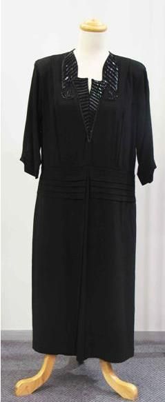 Appraisal: Dinner dress in black crepe with beaded accents to the