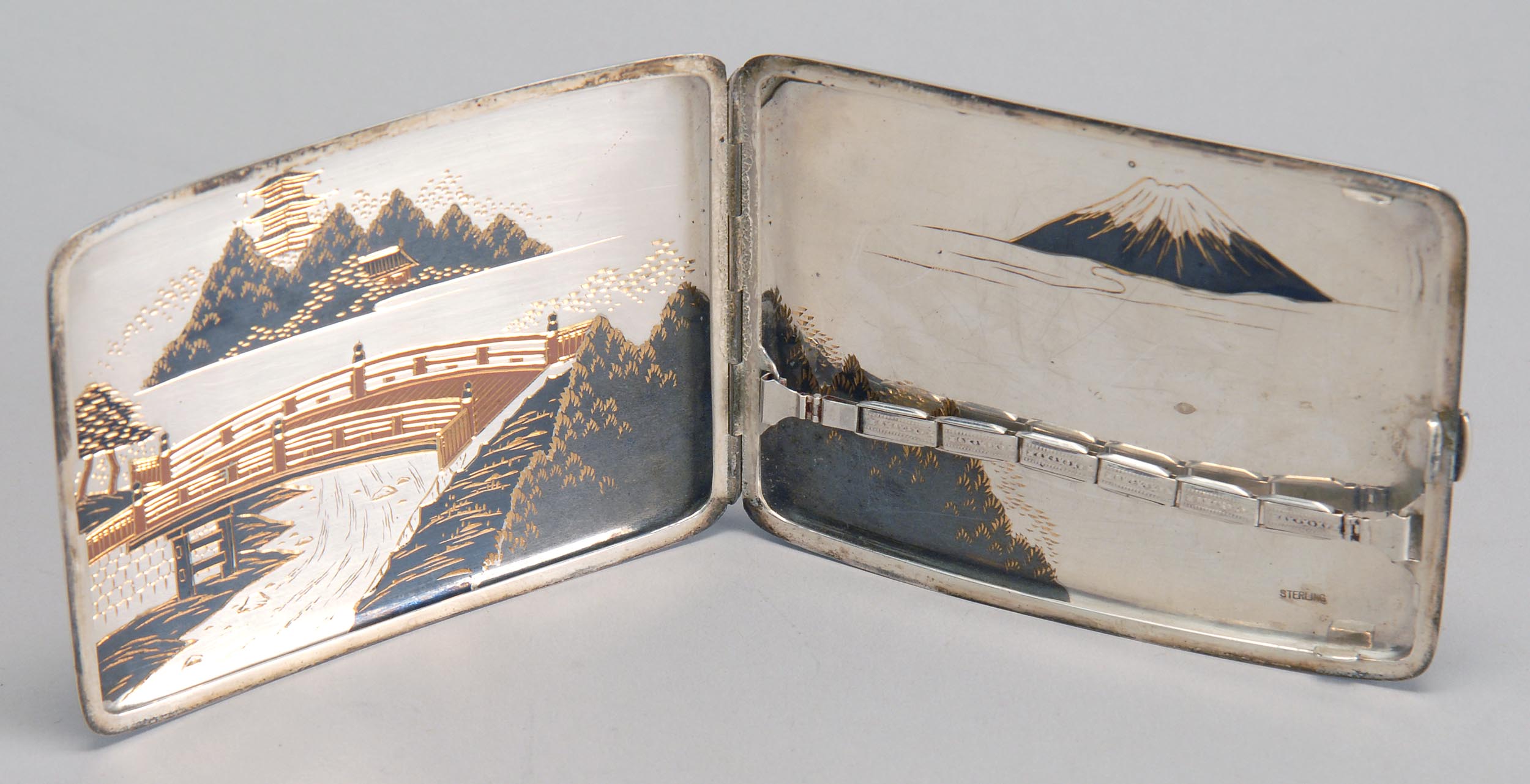 Appraisal: JAPANESE STERLING SILVER CIGARETTE BOX with Komai landscape decoration on