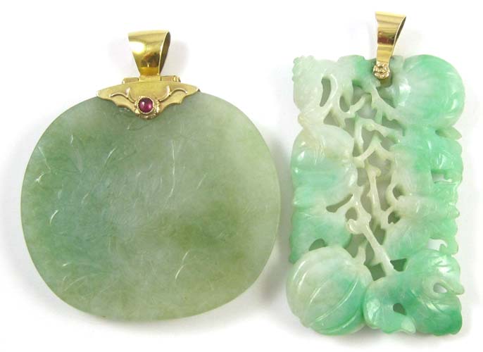 Appraisal: TWO LARGE GREEN JADE PENDANTS both with green jade carvings