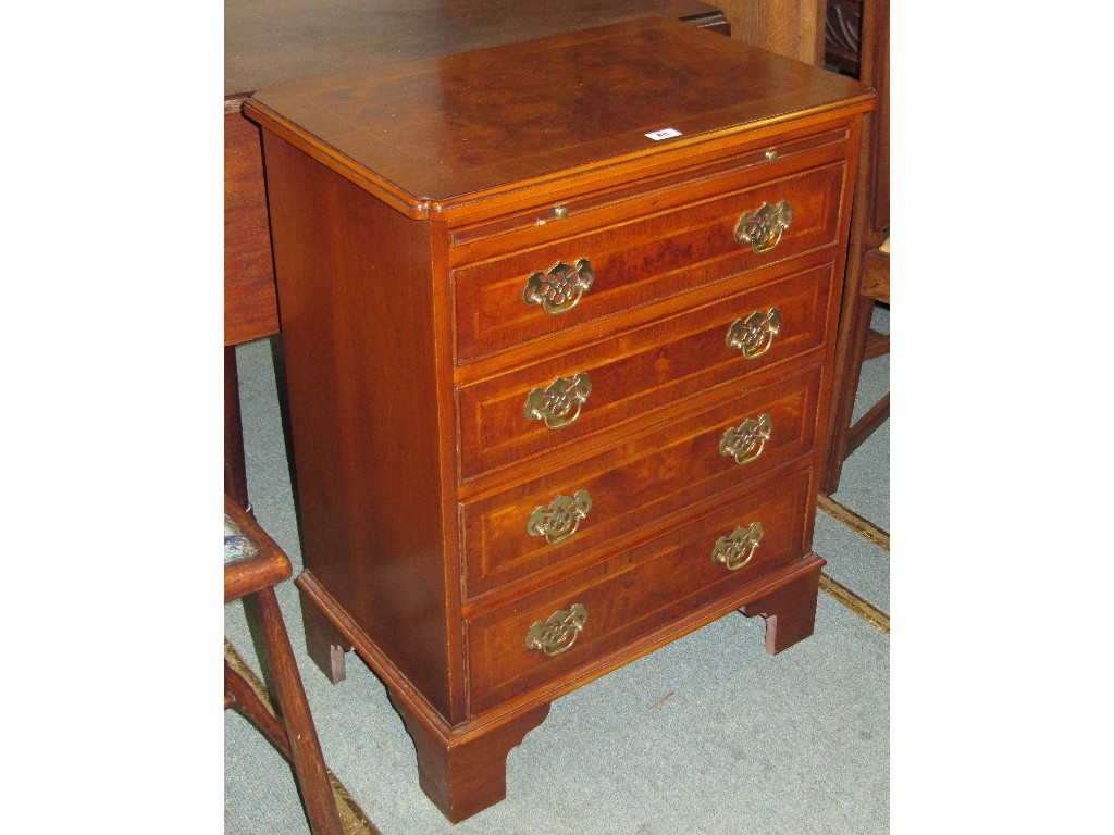 Appraisal: Reproduction walnut four drawer chest with brushing slide