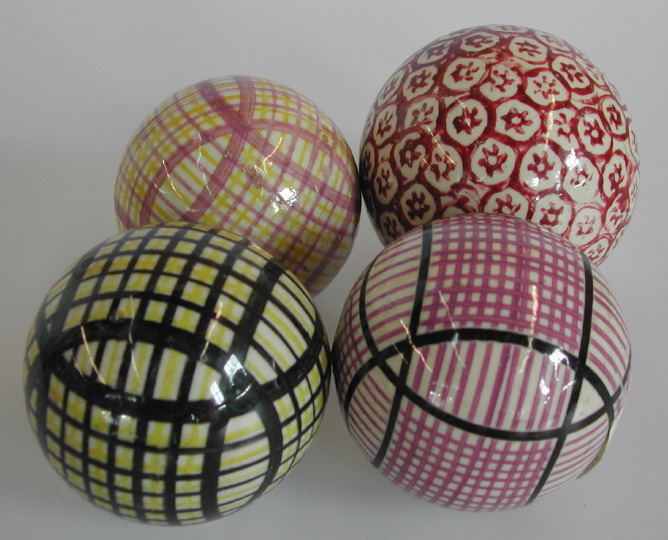 Appraisal: Collection of Four Brightly Glazed Pottery Carpet Balls third quarter