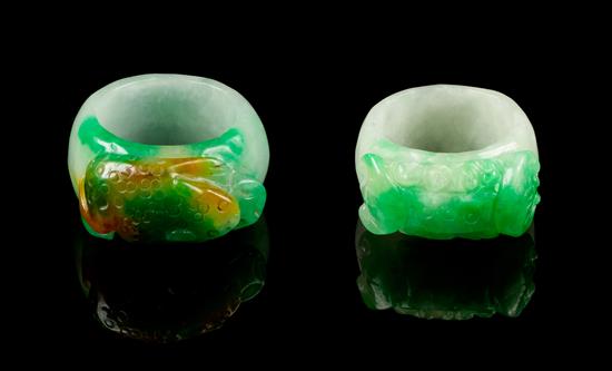 Appraisal: Sale Lot Two Jadeite Archer's Rings one carved to the