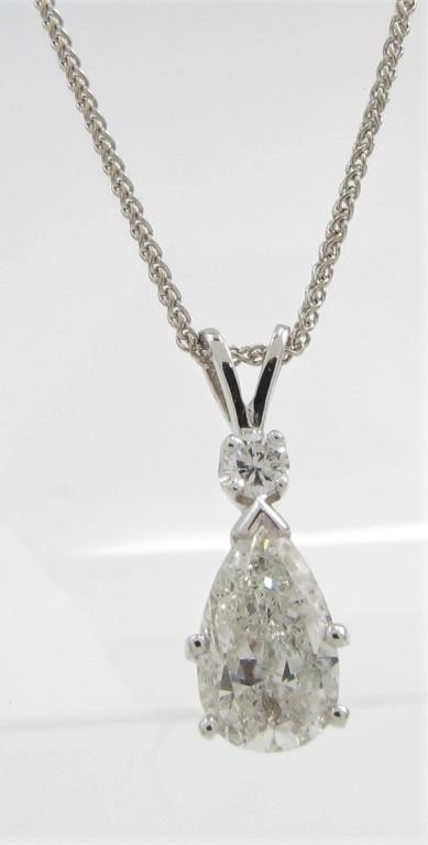 Appraisal: A K white gold pear shaped pendant featuring a laser