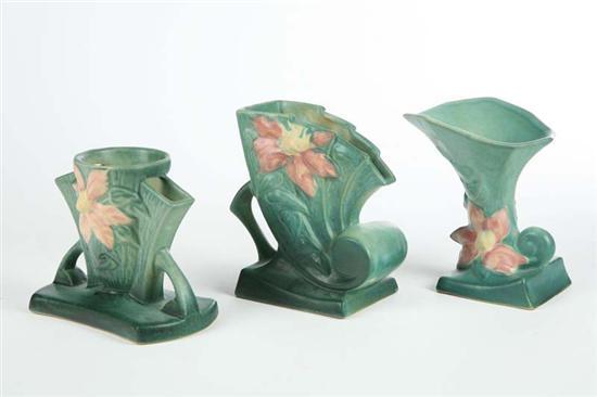 Appraisal: THREE ROSEVILLE VASES In the Clematis pattern A Cornucopia vase