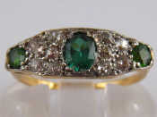 Appraisal: A yellow metal tests carat gold diamond and green garnet