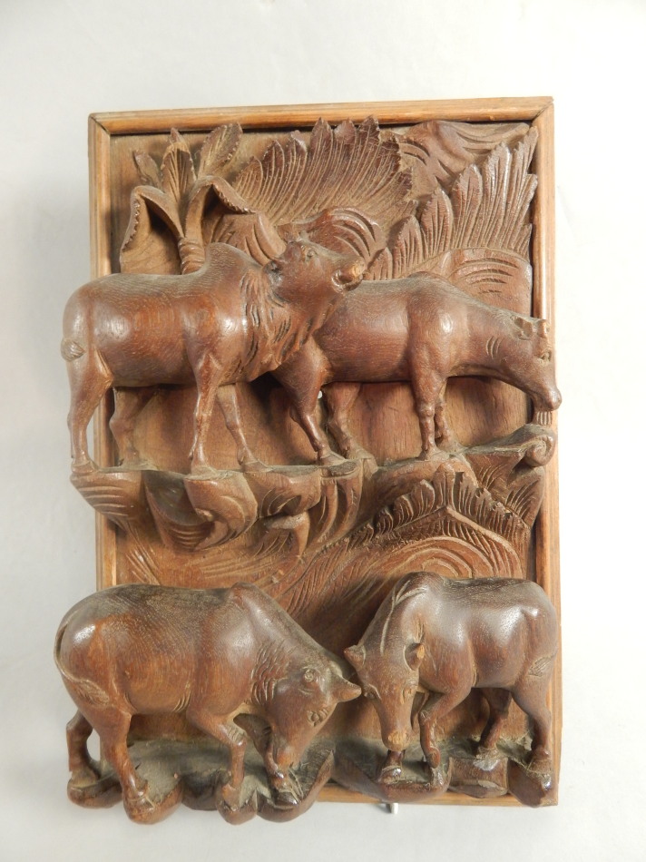 Appraisal: A late thC early thC Eastern teak plaque carved with